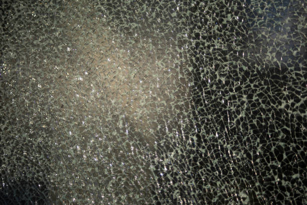 istock Small cracks on the glass. Broken window. Shards on the glass. 2162878740