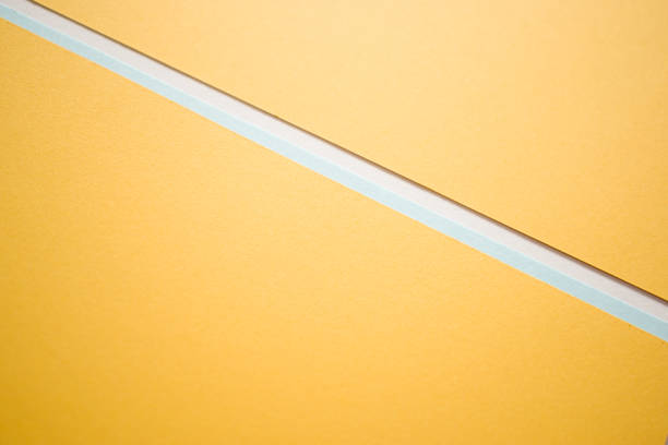istock Geometric light blue and yellow divided diagonally background 2162878999