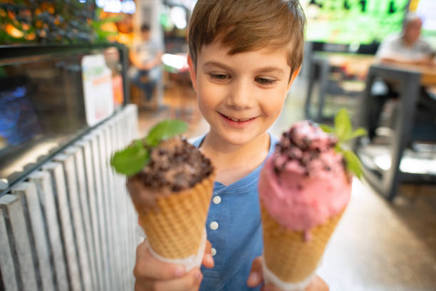 istock Happy cute boy with ice-cream 2162880749