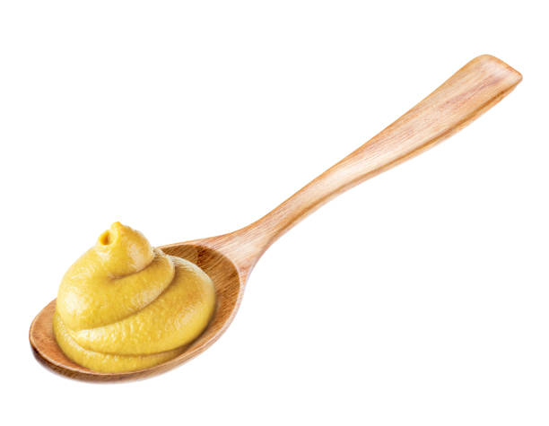 istock Squeezed mustard on a spoon isolated white background 2162880853