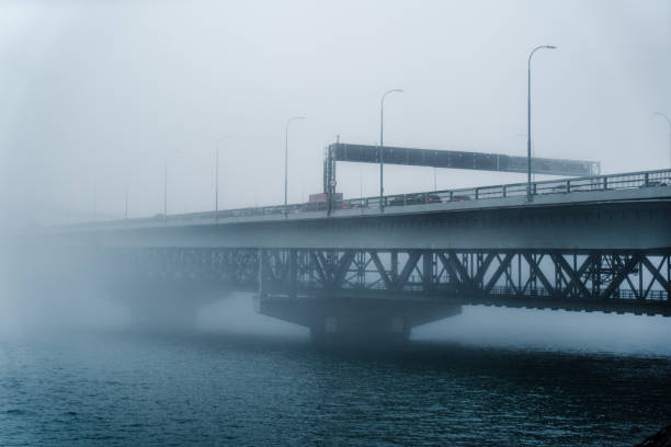 Foggy morning with Auckland harbour bridge seen from Westhaven