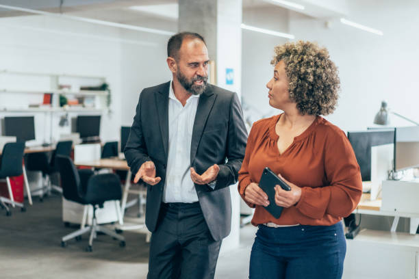 istock Smiling business persons having a conversation 2162883164