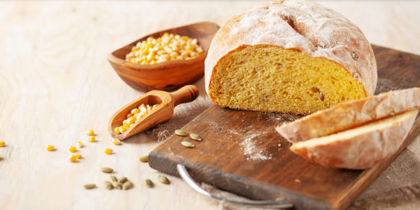istock Fresh cornbread and corn grains on the table. Food grain crisis concept 2162883560