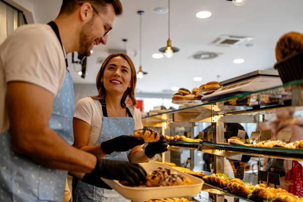 istock Team effort in bakery by male and female workers 2162884140