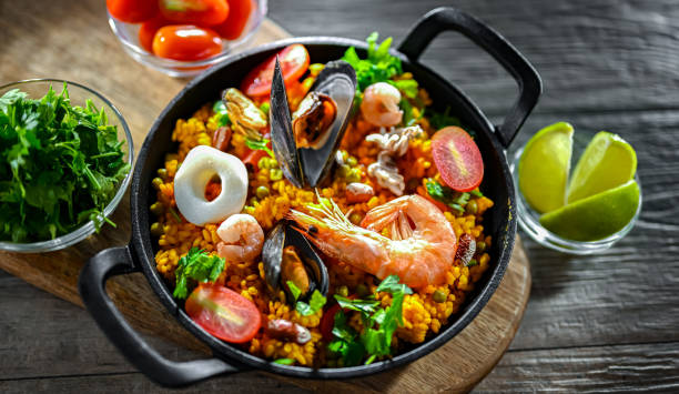 Seafood paella served in a cast iron pan