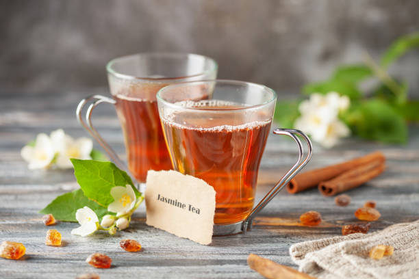 istock Tea with jasmine flowers in glass cup. Ceremony concept. 2162884317