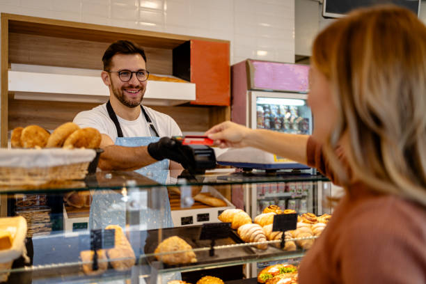istock Woman making card payment in bakery 2162884385