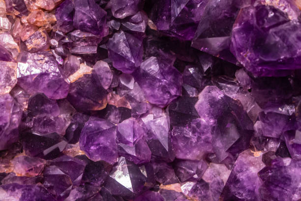 istock Amethyst quartz wallpaper. Polished gemstone textured background. Crystal raw stone texture 2162887276