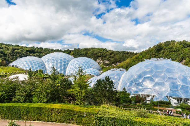 Eden Project, Cornwall, England August 14, 2023: Visitor attraction and educational centre which is featuring huge greenhouses, one featuring rainforest climate and plants.
