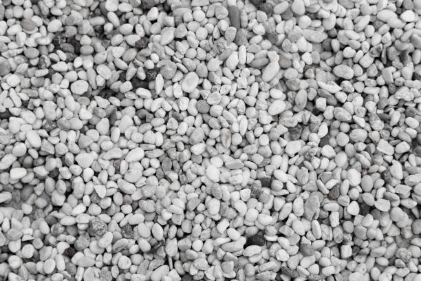 White round pebbles laid on the floor as an image for making the background.