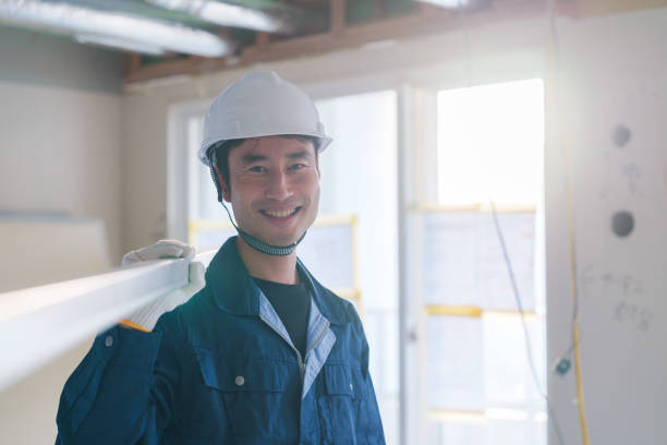 istock Male craftsman carrying materials at a construction site 2162894253