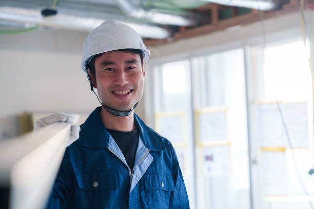 istock Male craftsman carrying materials at a construction site 2162894269