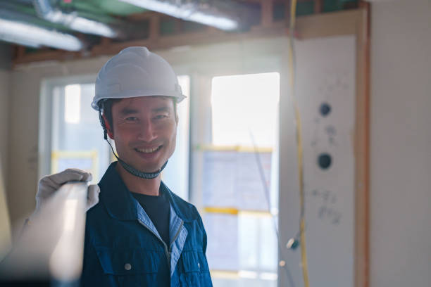 istock Male craftsman carrying materials at a construction site 2162894270