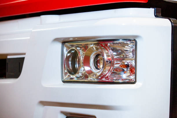 The headlight of a fire truck is shown up close, highlighting its powerful light and durable construction, designed for high-visibility and safety during nighttime operations