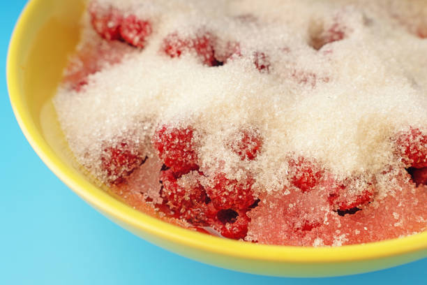 Raspberries covered with sugar in a bowl