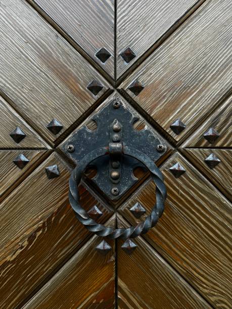old metal door handle on a wooden doors