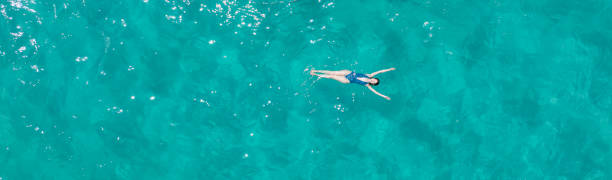 istock GIrl swimming 2162900392