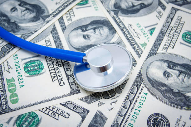 Stethoscope on US Paper Currency background.