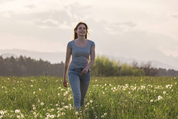 istock Young woman walking in nature 2162901275