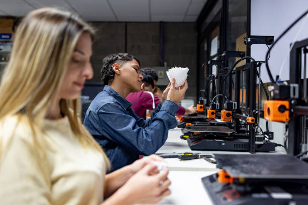 istock Student printing figures in 3D in a STEM class at the university 2162903095