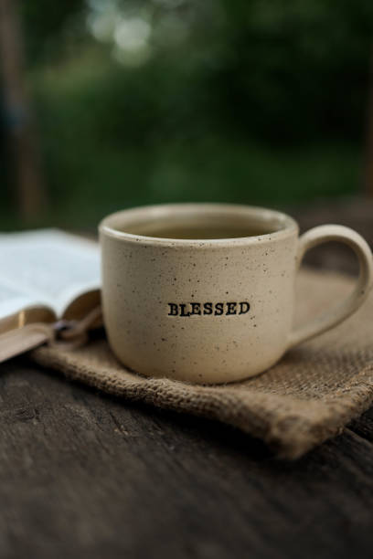 istock Cup with text BLESSED and open Bible in the garden, good morning 2162908307