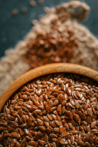 istock Flax seed in a wooden bowl. Close-up 2162909503