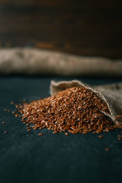 istock Flax seeds spill out of a burlap bag 2162909706