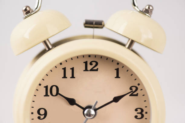 istock A large analog alarm clock on a white background. The idea of deadlines and hard work. Waking up at 10 a.m. A place for the text 2162910135
