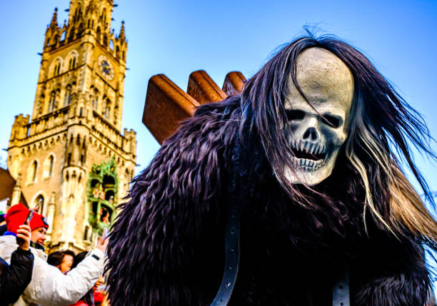 Munich, Germany - December 10: participants of the traditional Krampuslauf with costumes and wooden masks at the old town of Munich on December 10, 2023