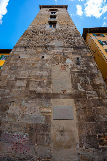 Pisa, Italy - June 02, 2024: Torre del Campano buiding, bell tower. Bottom to top view.