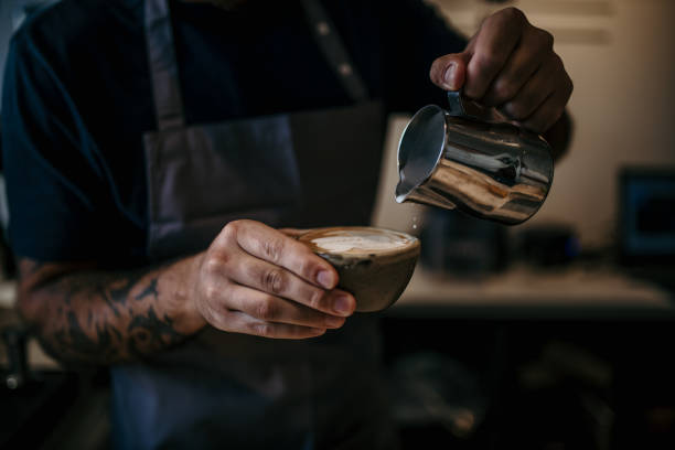 istock Barista making coffee with a coffee machine in a cafe 2162913037