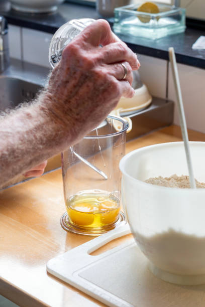 istock arm of senior preparing  dough 2162921927