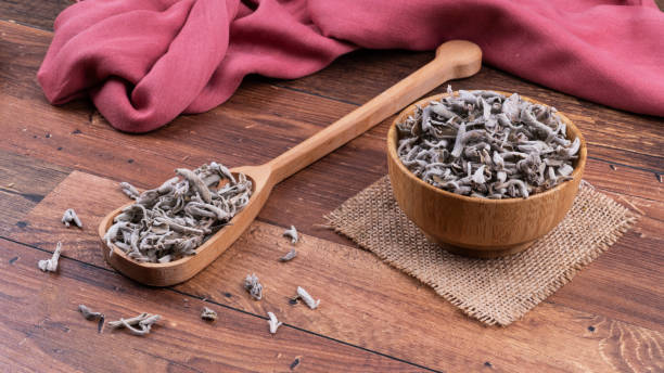 istock sage in a spoon on wooden surface 2162926927