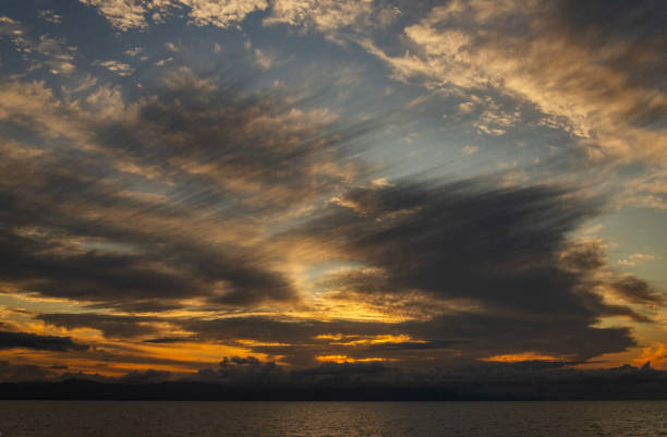 Dramatic clouds during sunset over Cairns. Cairns is major tourist destination with access to Daintree Rainforest and Great Barrier Reef.