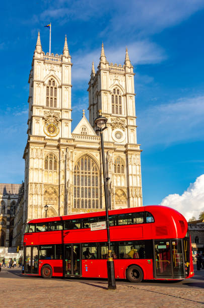 istock Double-decker bus and Westminster Abbey in London, UK 2162929718