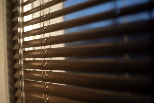 istock Blinds on the window. Interior details. Light through glass. 2162929936