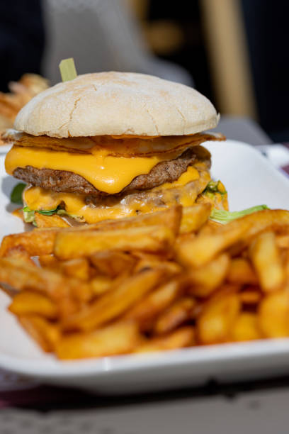 istock Double cheeseburger and fries on a casual day. 2162932540