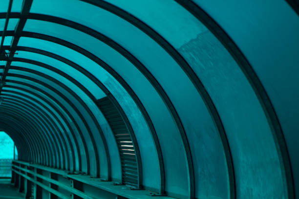 Spherical tunnel. Closed bridge over the road. Crosswalk. Empty tunnel.
