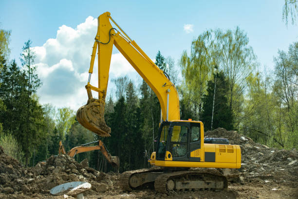 istock Construction equipment digs ground. Excavated soil. Bucket digs mound. 2162937427