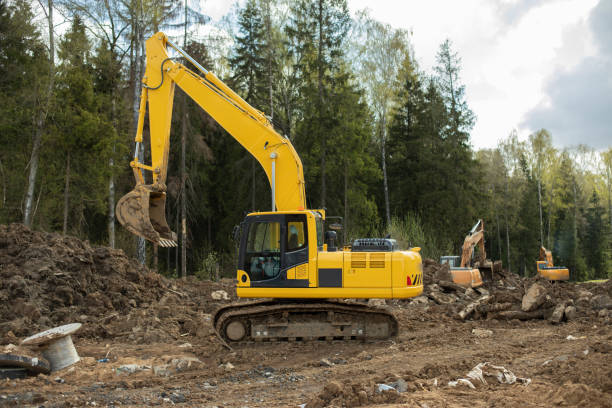 istock Construction equipment digs ground. Excavated soil. Bucket digs mound. 2162937453