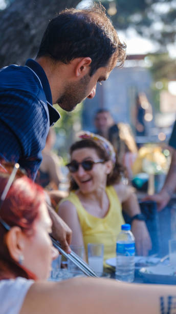 istock Friends grilling together at a picnic area 2162937571