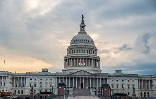 istock United State Capital Hill architecture at sunset with dark clouds 2162938085