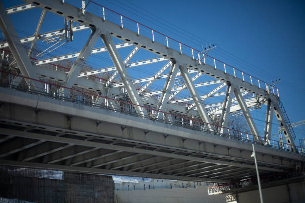 Bridge with railway. Steel bridge. Transport architecture for trains. Details of the support.