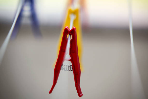 istock Plastic clothes pegs on the clothes dryer. Background. Horizontal. 2162940976