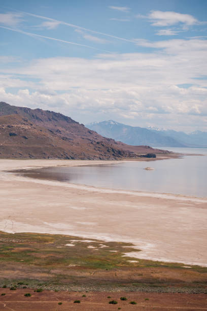 These photos of Antelope Island in Utah capture the island's rugged beauty and unique landscape. The images highlight the expansive, golden-hued plains of the island, framed by the striking contrast of the Great Salt Lake's vast, shimmering waters. The island's rugged terrain is punctuated by rocky outcrops and rolling hills, providing a dramatic backdrop to the serene lake. In some shots, the island’s diverse wildlife, including herds of bison and pronghorn antelope, adds life and movement to the tranquil scenery. The photos also showcase the breathtaking views of the surrounding mountains, with their snow-capped peaks and sweeping vistas. These images beautifully capture the essence of Antelope Island’s natural splendor, illustrating its remote charm and the serene yet dramatic interplay between land and water.