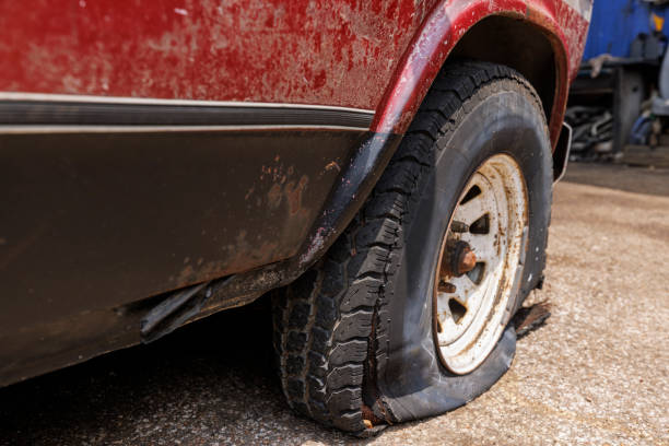 istock Flat Tire on a Weathered Vintage Truck 2162943599