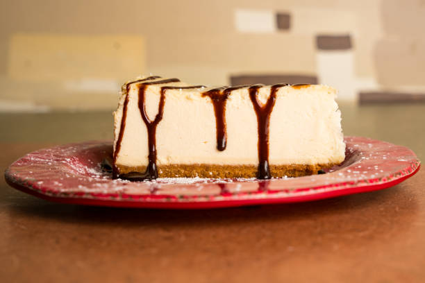 Slice of cake or cheesecake with strawberry jam decorated with red berries, dessert, food