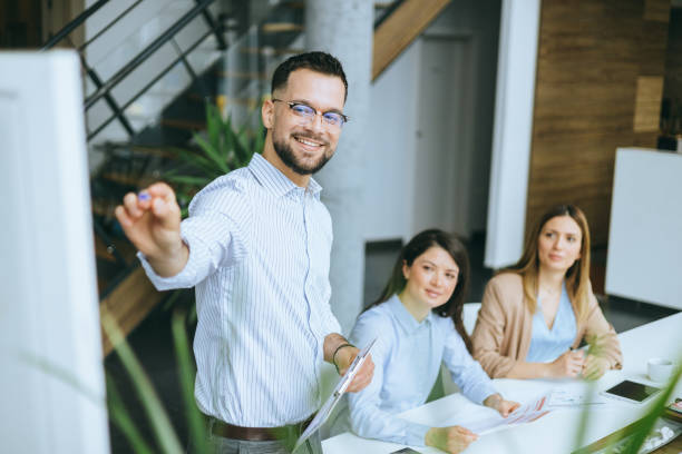 istock Man leading a team meeting with confidence 2162946024