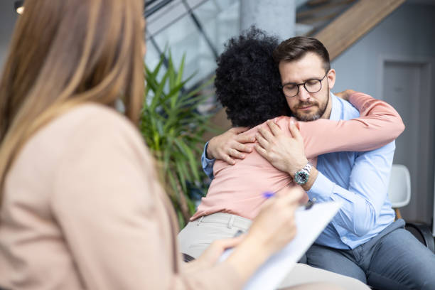 istock Coworkers hugging at business location 2162946036