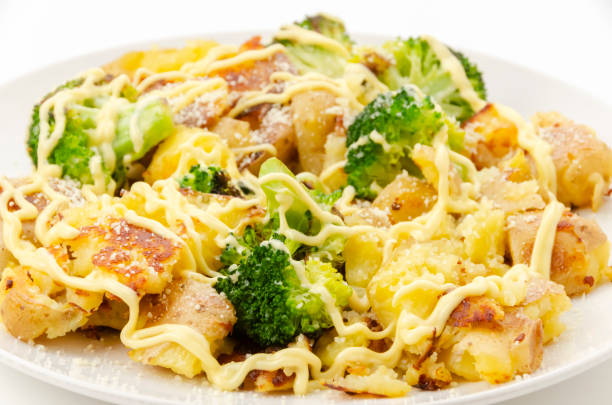 Baked potatoes and broccoli with mayonnaise dressing